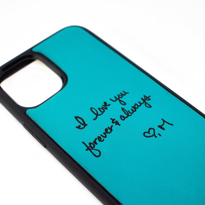 Turquoise phone protector case with custom handwriting from a photo. Engrave your own personal message on these leather phone cases.