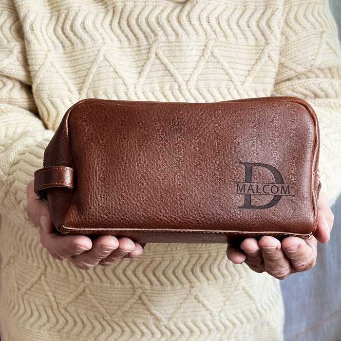 Engraved men’s leather dopp kit personalized with initials, perfect as a custom toiletry bag for travel, weddings, or holiday gifting. Crafted from genuine leather with Italian zipper and timeless design.