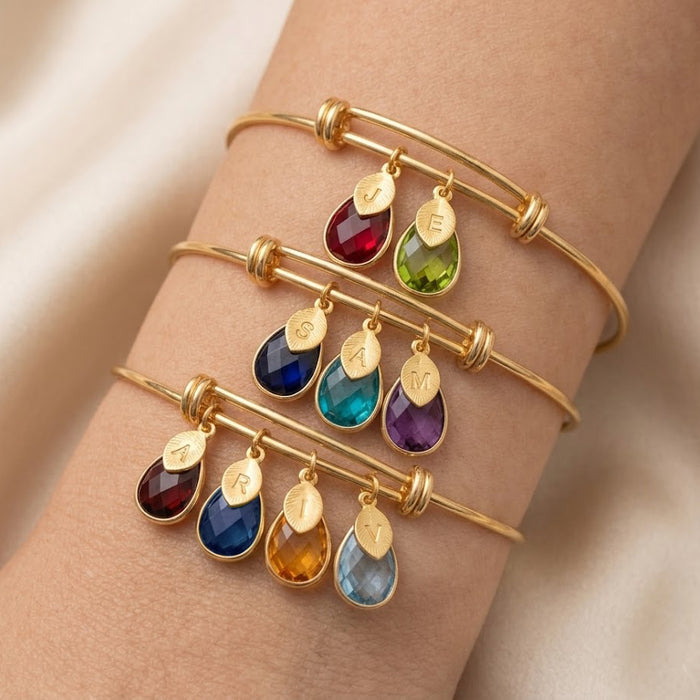Birthstone charm bracelet with up to multiple gemstones and initial charms personalized family bangle
