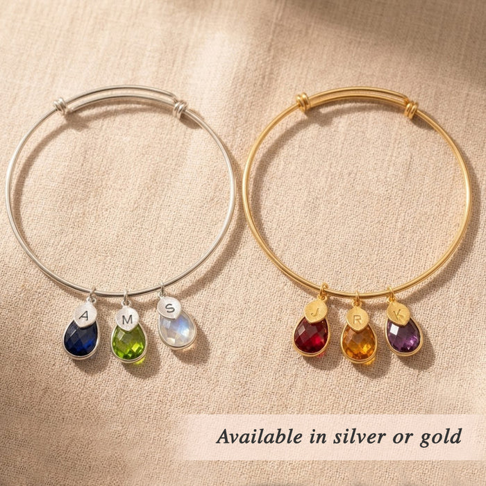 Gold bangle bracelet with dangling birthstone charms and engraved initial tags personalized jewelry