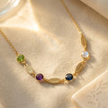 Personalized mom necklace with name charms and birthstones, custom family necklace with engraved gold bar charms and colorful gemstones.
