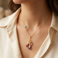 Personalized birthstone necklace for mom with round connector stone, cascading teardrop birthstones, and engraved initial charms, a meaningful family necklace gift.