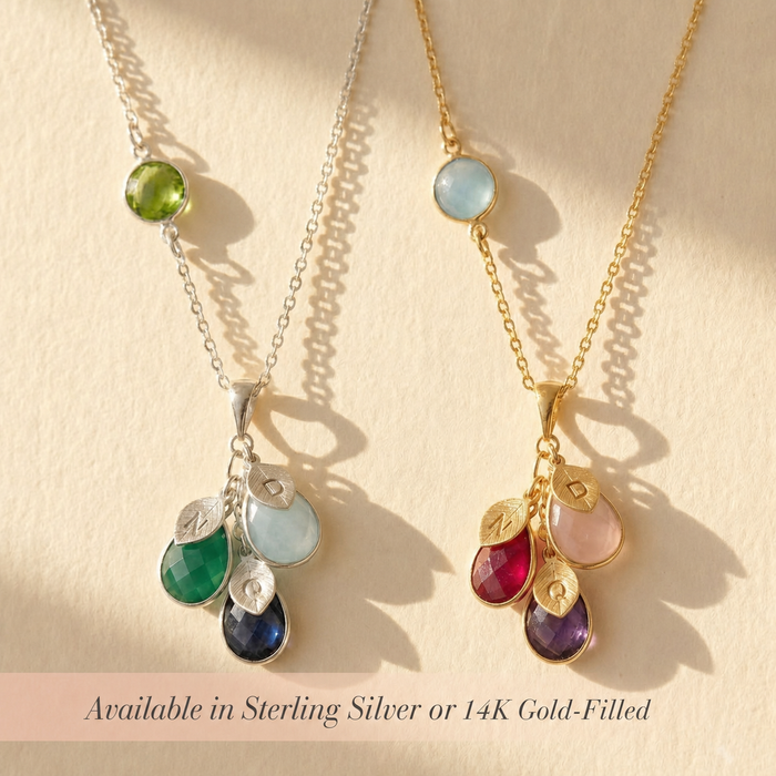Personalized birthstone necklace available in sterling silver or 14K gold filled, shown with round mom stone, teardrop kids stones, and initial charms.
