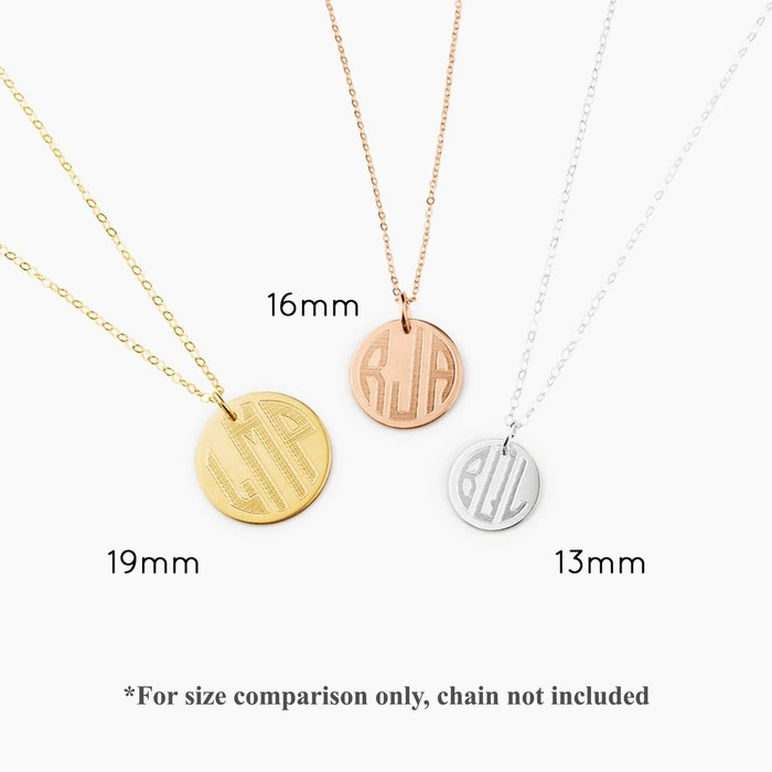 Three engraved monogram disc pendant necklaces.