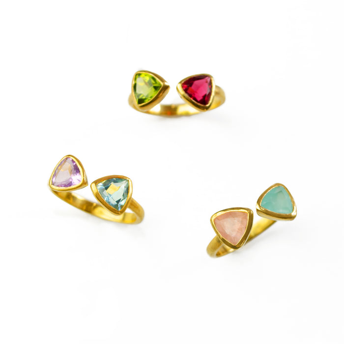 Three triangle bow tie rings with mix and matched birthstones. Custom birthstone ring, adjustable triangle ring, bow tie gemstone ring, personalized jewelry, double triangle ring, mix-and-match birthstones, sterling silver bow tie ring, gold bow tie ring, rose gold bow tie ring, unique birthstone gift, triangle-cut gemstone ring, customizable birthstone jewelry, adjustable band ring, personalized triangle ring, birthstone stacking ring, custom gemstone jewelry, unique gift for her, triangle gemstone ring