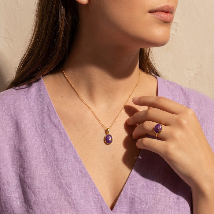 Model wearing matching purple turquoise ring and pendant necklace