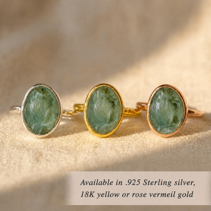 Rough green tourmaline rings displayed in sterling silver, yellow gold vermeil, and rose gold vermeil.