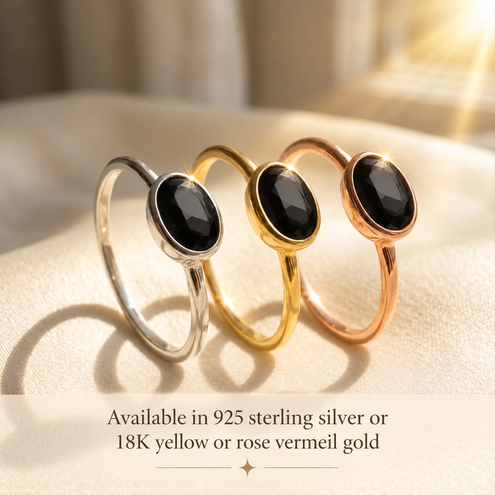 Small oval birthstone rings stacked in yellow gold vermeil in natural light