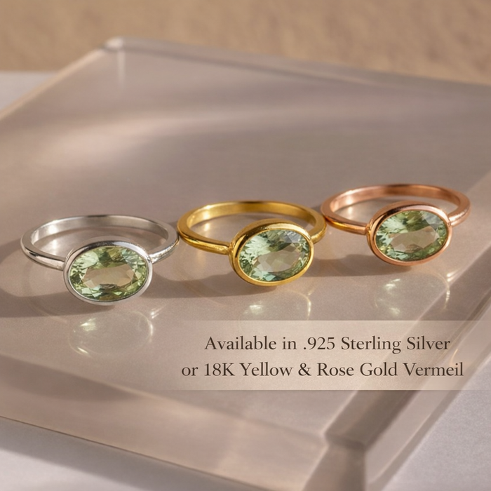 Small oval green amethyst ring displayed in multiple metal finishes, including sterling silver, yellow gold vermeil, and rose gold vermeil. Bezel-set prasiolite gemstone ring showcasing a minimalist oval design. Handmade February birthstone jewelry perfect for stacking, gifting, or everyday wear.