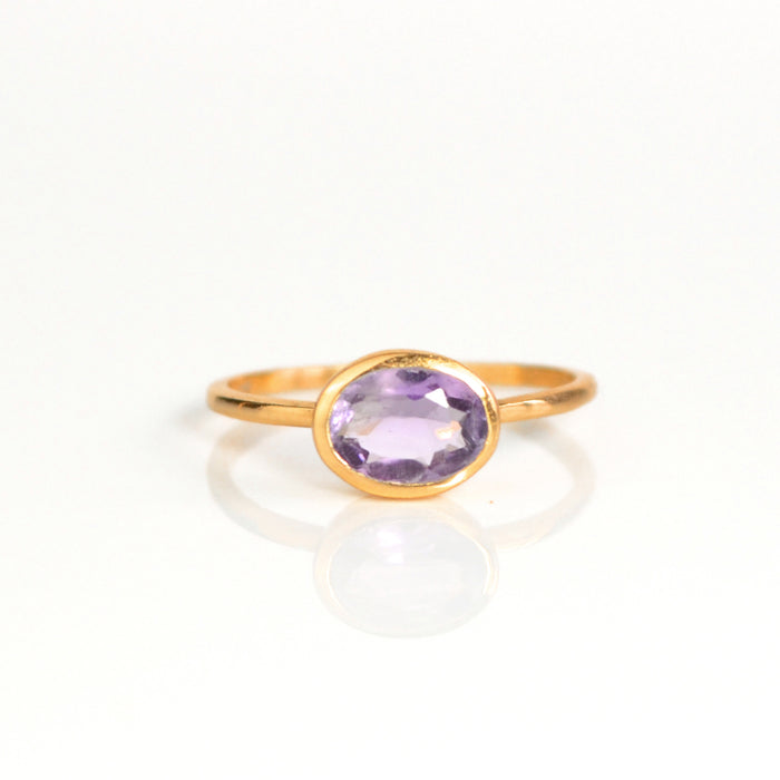 a rose gold purple amethyst ring shown on white background. stackable! Stacking rings, bezel set, small oval, tiny oval, dainty oval, birthstone rings, sterling silver stamp, birthstone ring, birthstone jewelry, purple gemstone, purple birthstone, february birthstone, february gemstone, purple gemstone, purple birthstone, february birthstone, february gemstone, stack set, stacking rings, gemstone ring, birthstone ring, mother's day gift for her, gift for mom, gift for fiance, gift for girlfriend