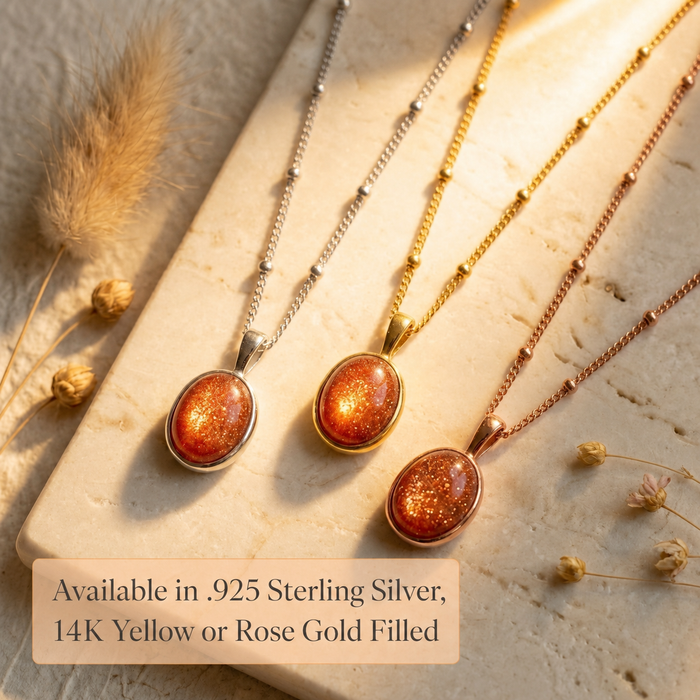 Sunstone necklaces displayed in yellow gold, rose gold, and sterling silver options, showing oval orange gemstone pendants on delicate chains.