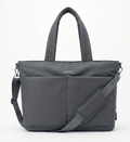 Gray tote bag with shoulder strap on a white background