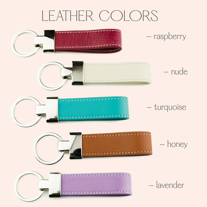 Personalized leather loop keychain color options in raspberry, nude, turquoise, honey, and lavender, shown with silver metal hardware and durable stitching. Custom engraved keychains can be personalized with names, initials, dates, or handwriting, making them unique gifts for mom, dad, graduation, promotion, retirement, wedding, new driver, or everyday use. Handmade leather accessories designed for gifting on birthdays, Christmas, Father’s Day, or Mother’s Day.