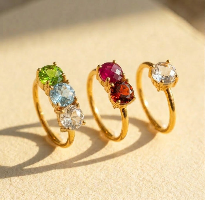 Family birthstone rings for mom with three custom gemstones in gold and silver finishes