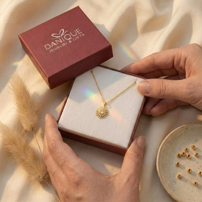 Gift box image showing a tiny birthstone necklace presented in Danique jewelry packaging for birthdays, bridesmaids, moms, or daughters.