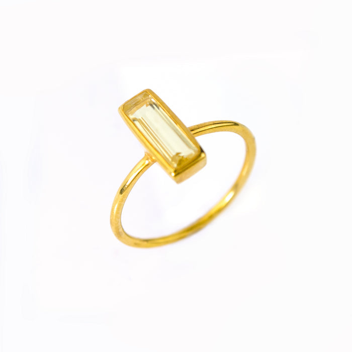 Gold filled tiny gemstone adira bar ring with citrine birthstone on white background. November birthstone, november birthday.