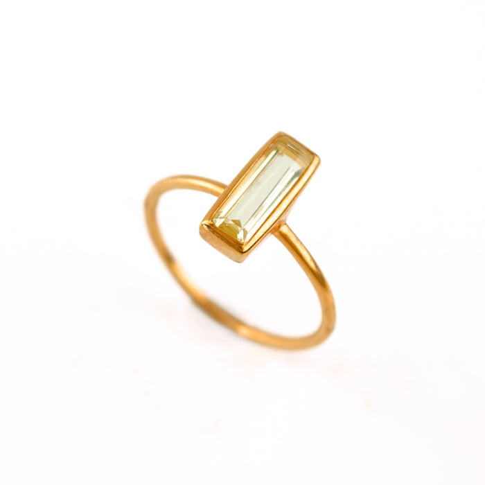 Single rose gold filled adira tiny bar citrine gemstone ring. November birthstone on white back ground.