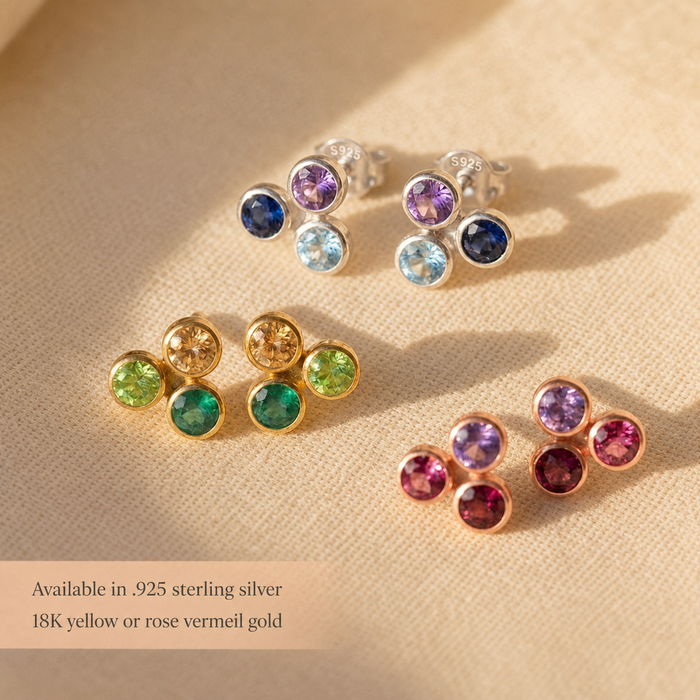 Triple birthstone stud earrings in sterling silver, yellow gold, and rose gold with custom gemstone combinations for family jewelry.