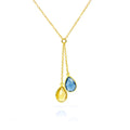 Dainty Ukrainian necklace with blue and yellow teardrop birthstones arranged on a slim lariat drop, crafted in gold-filled with 18k vermeil bezels. Minimalist support-Ukraine jewelry that layers beautifully with other necklaces; ideal charity gift, birthday or Christmas present. Adjustable chain, lightweight design, high-shine finish; meaningful blue and yellow colors inspired by the Ukrainian flag. Keywords: ukrainian necklace, lariat birthstone necklace, peace jewelry, fundraiser gift.