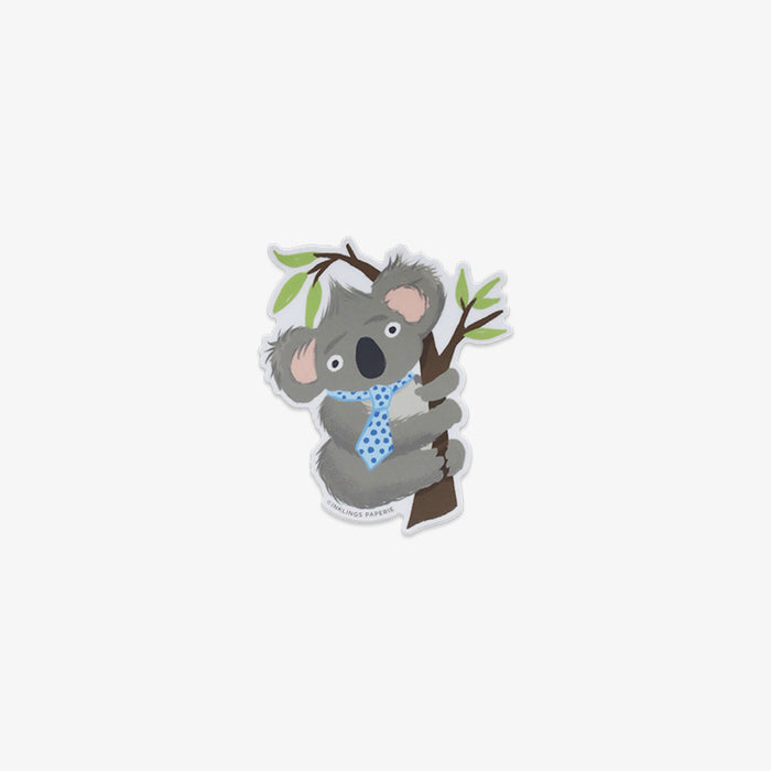 Vinyl sticker of a koala holding a branch on a white background