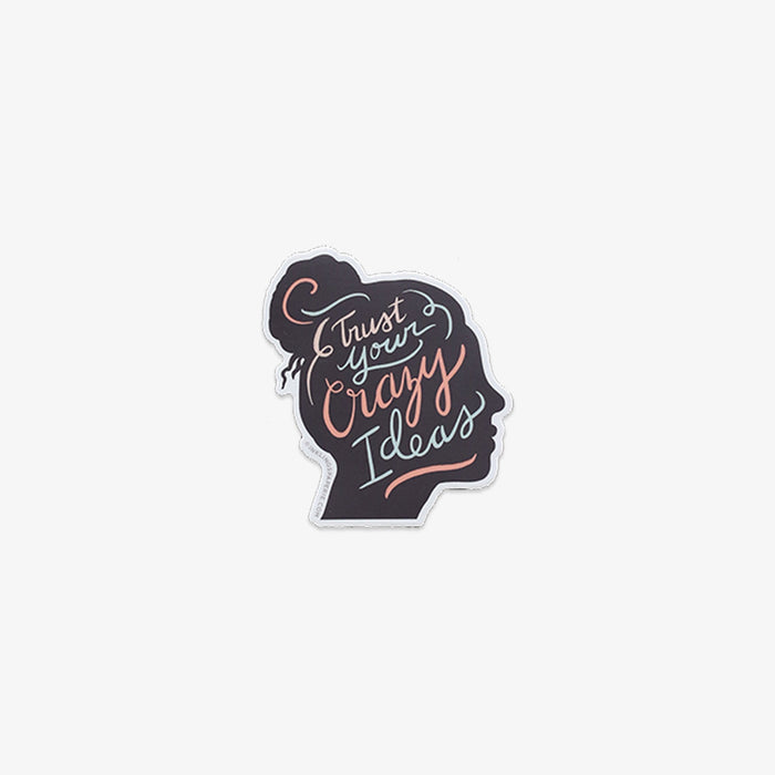 Vinyl sticker with silhouette of a head and 'Trust Your Crazy Ideas' text on a white background